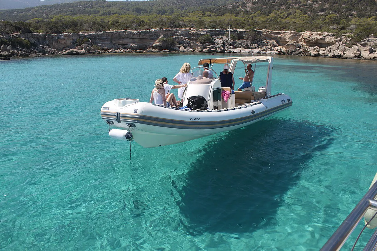 Boat in the turquoise water of the Blue Lagoon.