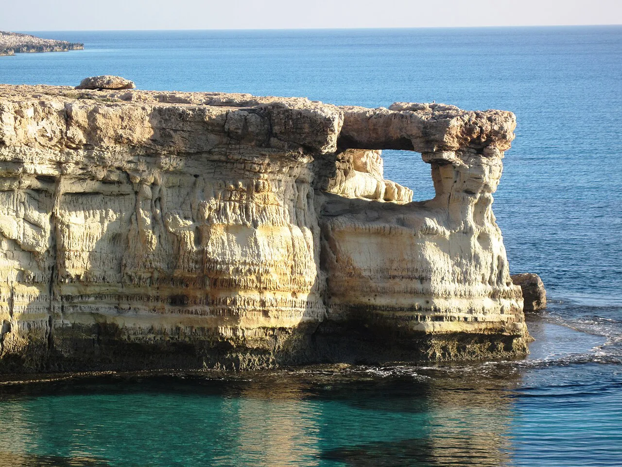 Rock arch on the coast at Cape Greco.