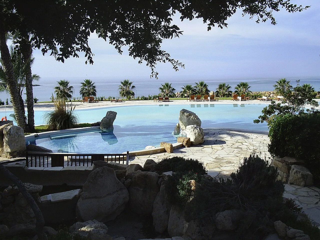 Swimming pool with palms at Coral Bay.