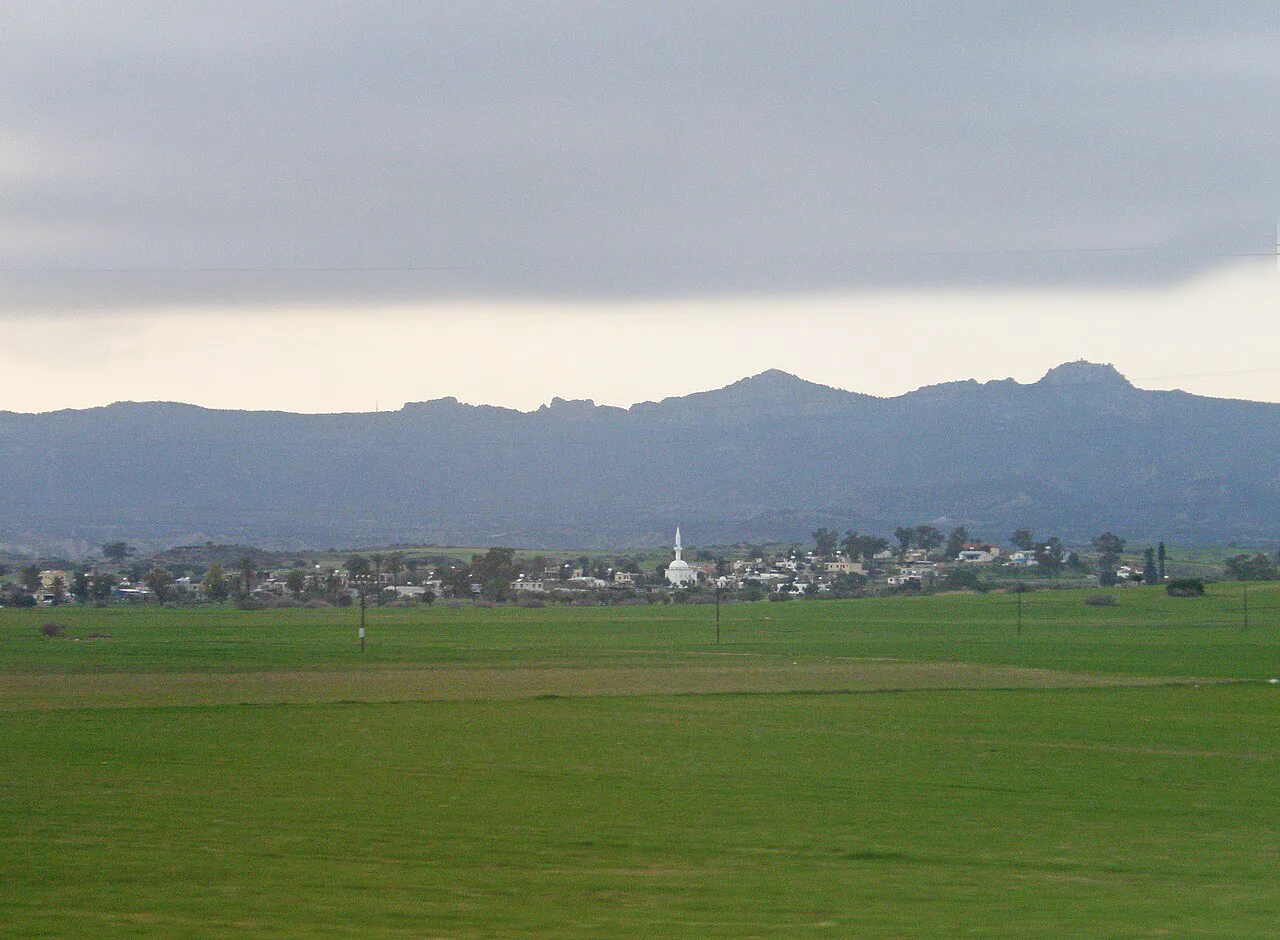 Green plain below the Kyrenia Mountains.