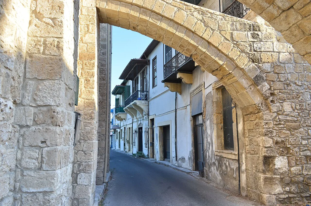 Stone arch over a street in Larnaca old town.