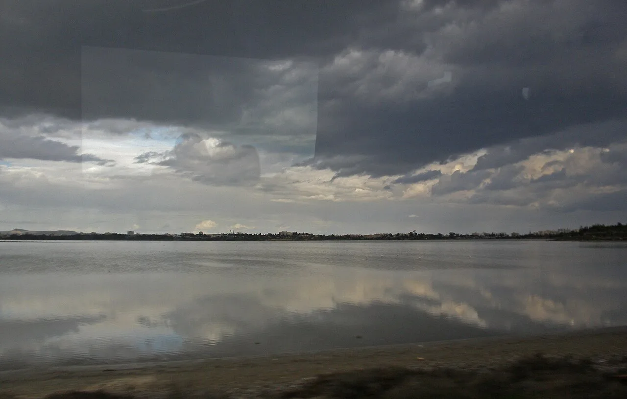Larnaca Salt Lake under a cloudy sky.