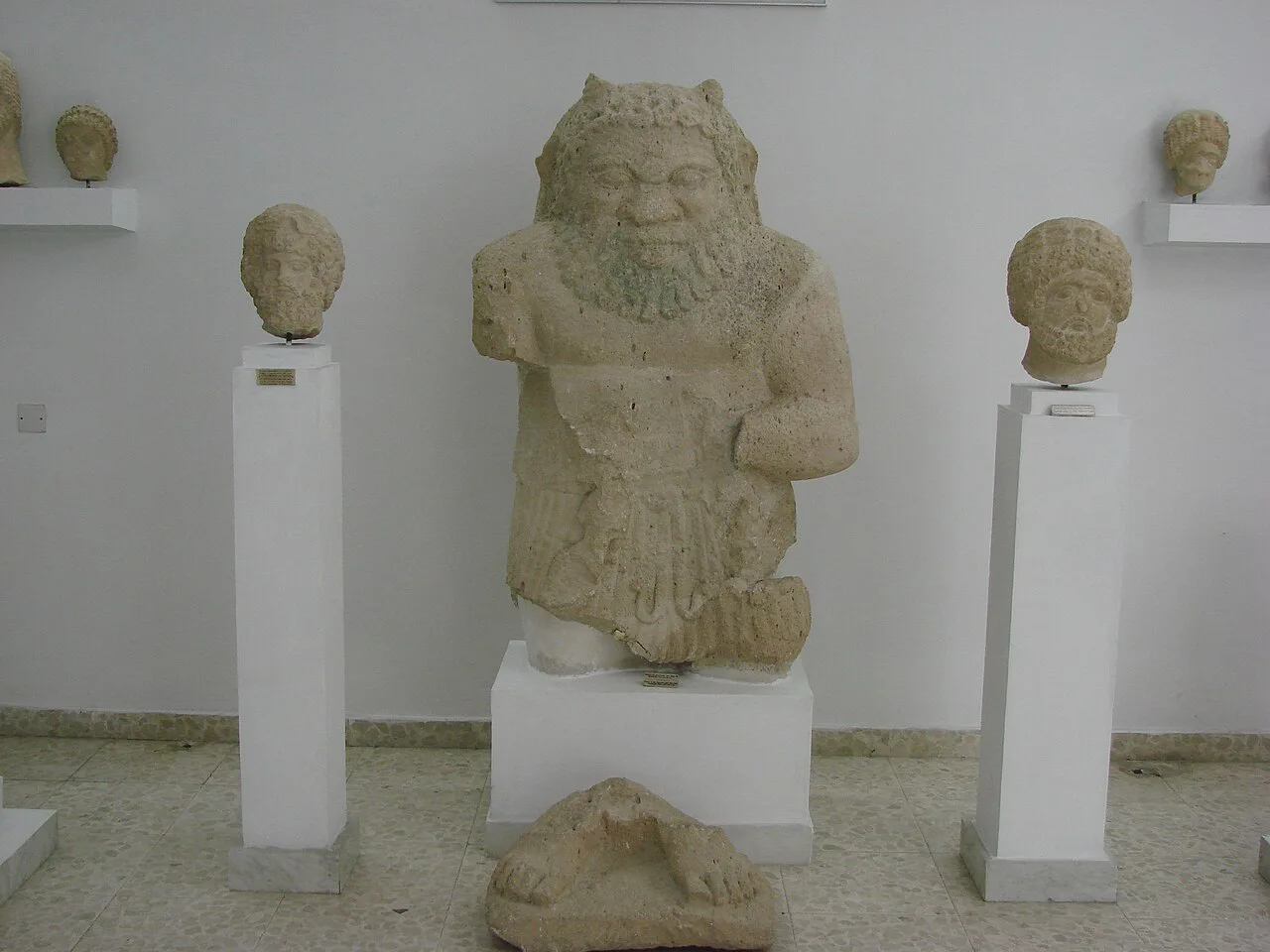 Bes and Zeus Lavranios statues in the Limassol Archaeological Museum.