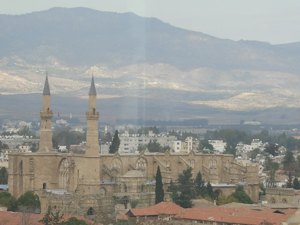 Nicosia old town with a mosque and hills beyond.