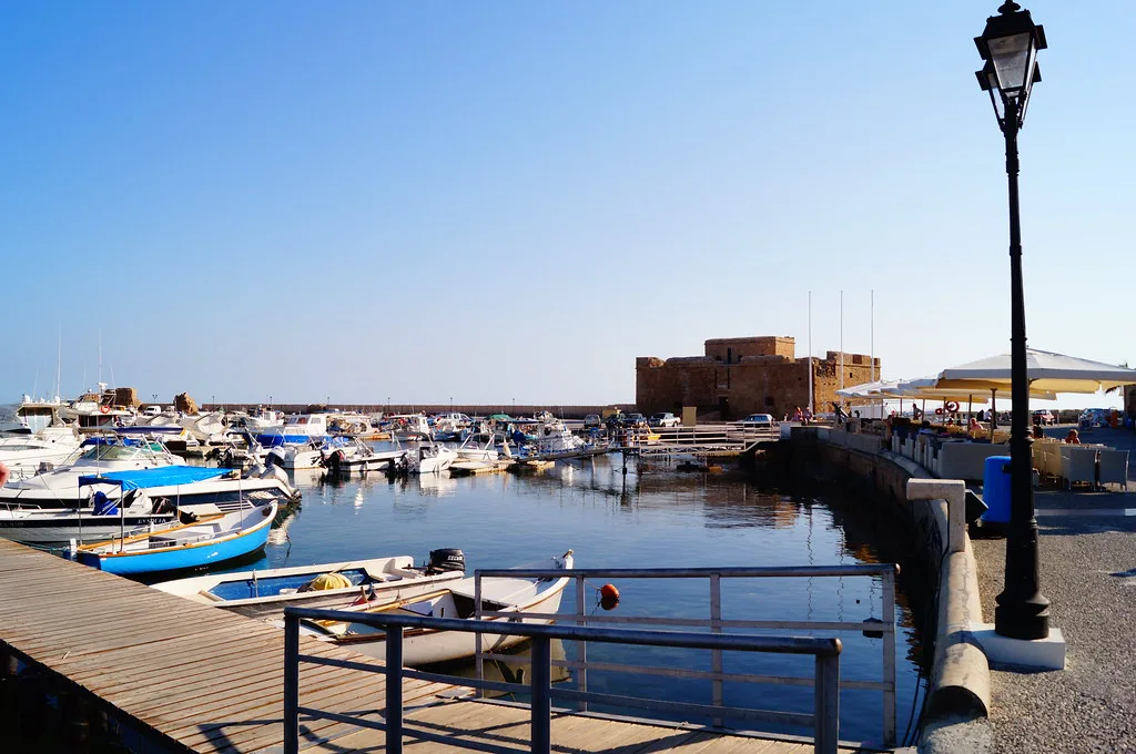 Boats in Paphos harbour, with the medieval fort beyond.
