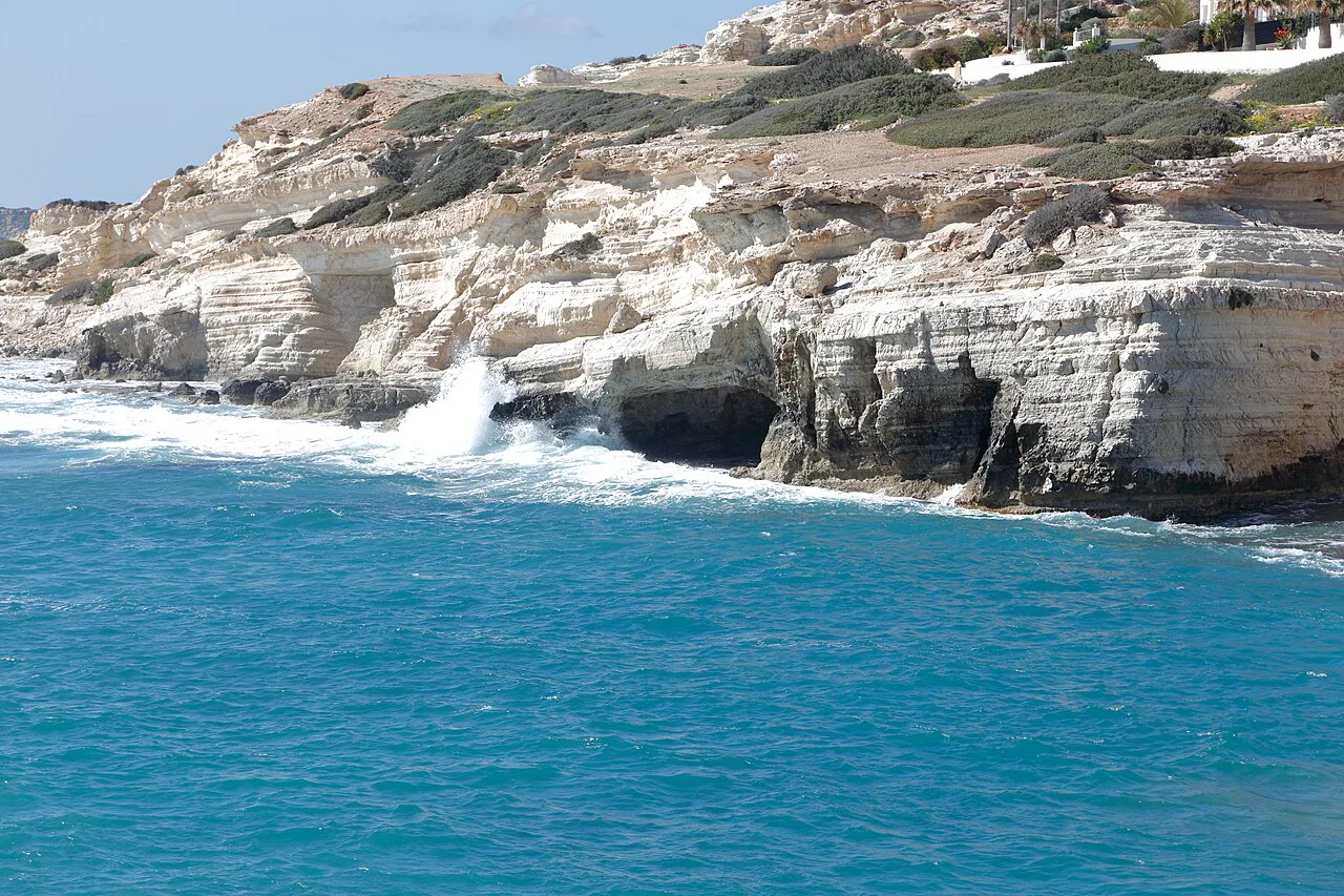 Waves at the foot of the cliffs by the Peyia sea caves.